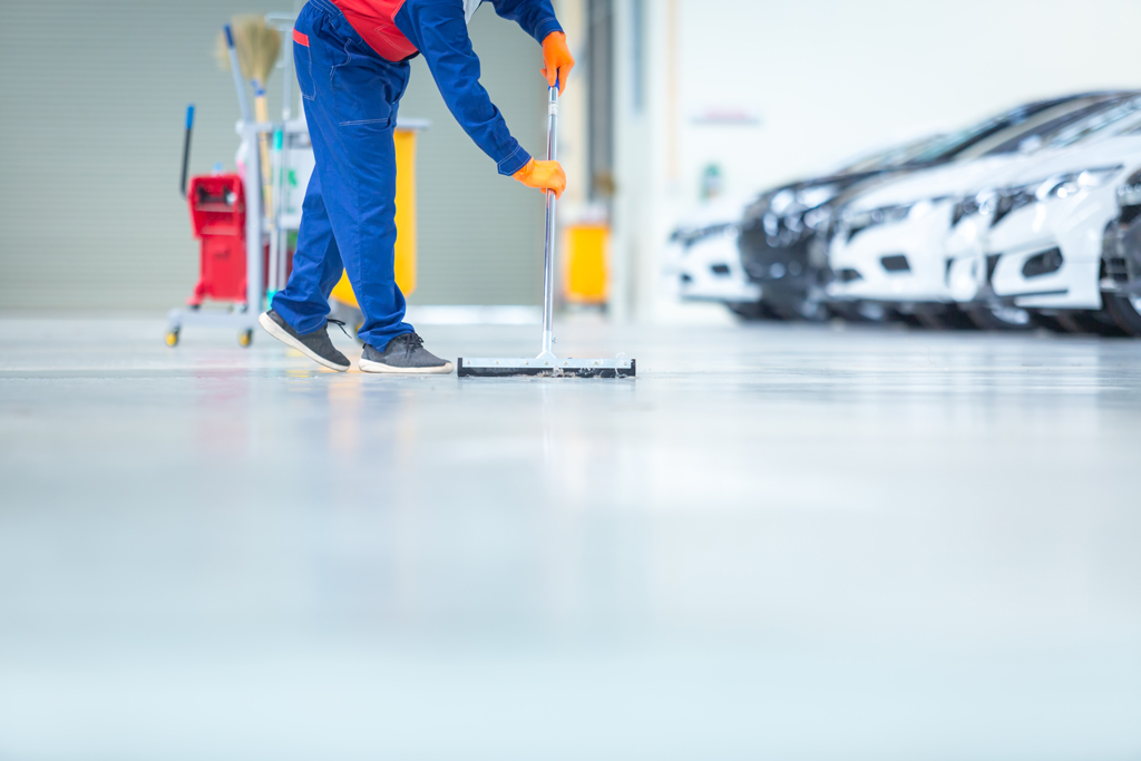 Car mechanic repair service center cleaning using mops to roll w